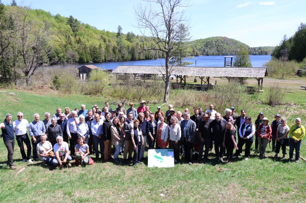 Conservation partners gather at Camp Tamaracouta in Mille-Isles, QC, on May 20, 2026 to celebrate the conservation of the historic camp.