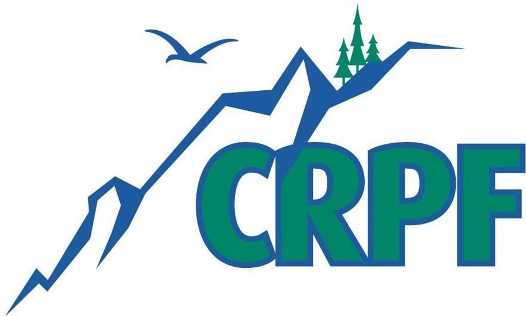 A logo with stylized blue mountains, a bird silhouette, green trees, and the letters CRPF.